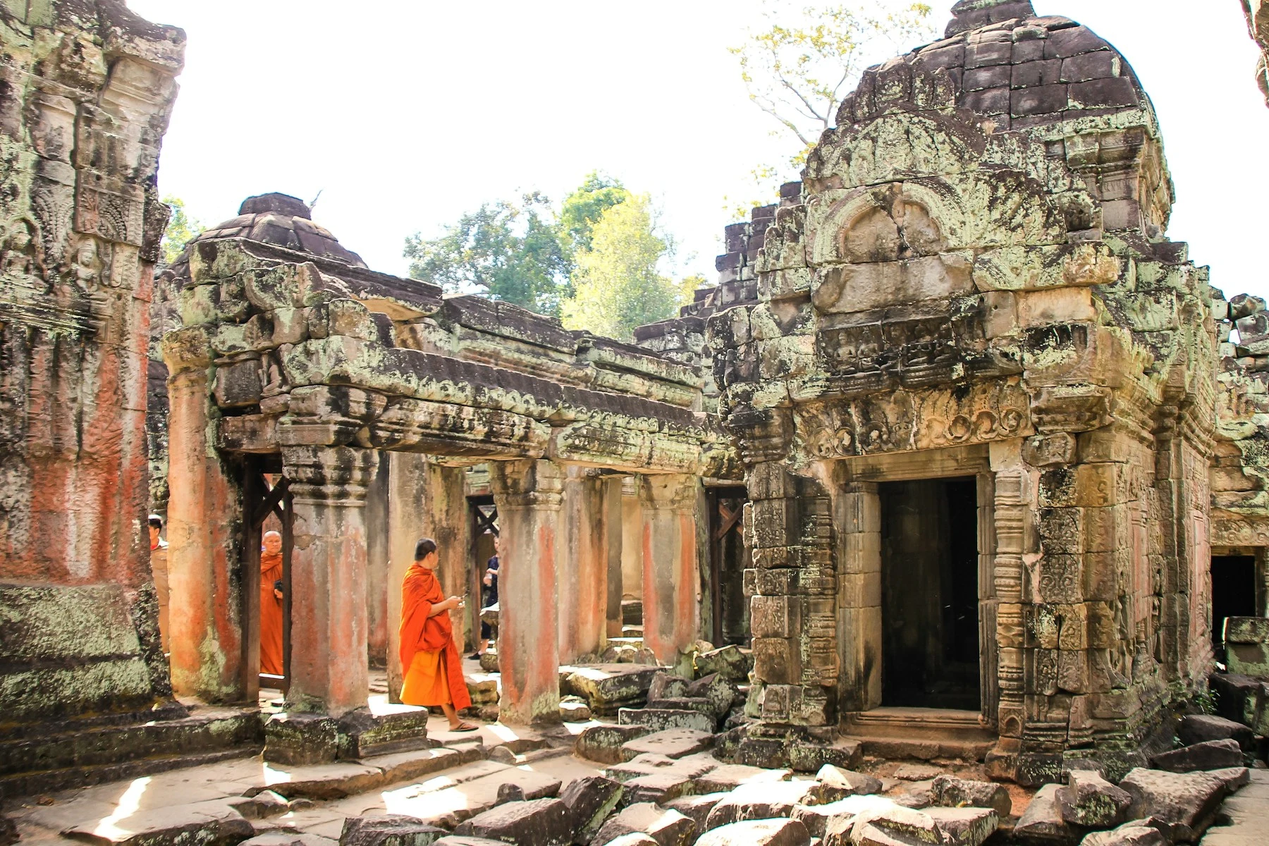 Visitors in a temple gallery at Angkor.